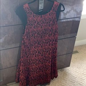 Red lace dress with black details